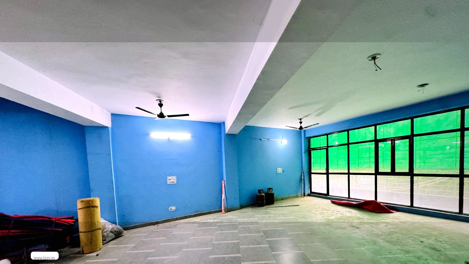 Lozy warehouse shed for rent at Murthal, Sonipat on NH-44 - clear interior floor with steel truss roof and daylight from the loading face