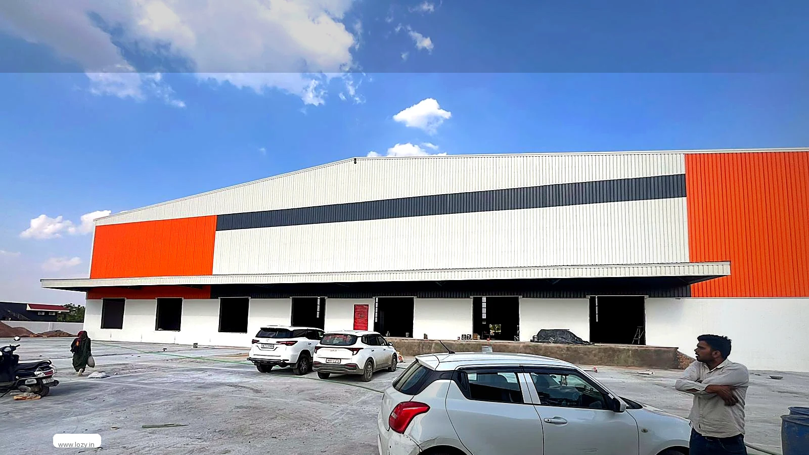 Ready-to-move warehouse shed with a paved yard and dock-side loading position at a Lozy facility