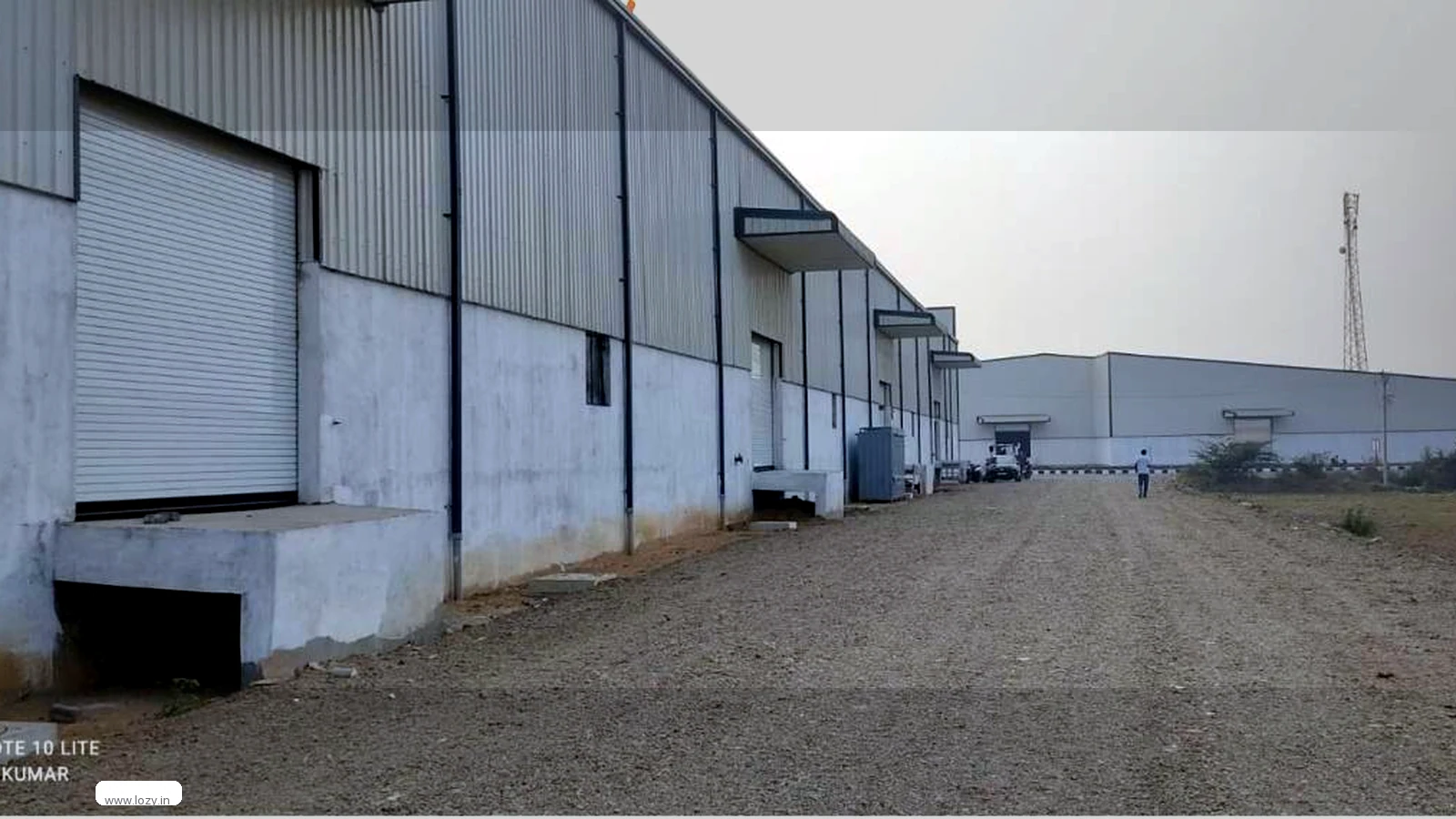 Racked storage bays and palletised goods on a Lozy warehouse floor in Ahmedabad, Gujarat