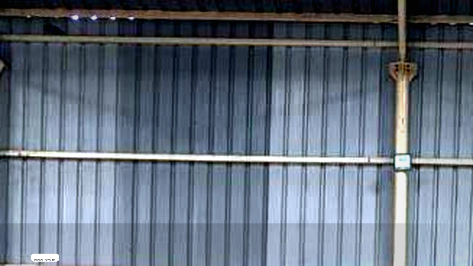Loaded pallets and cartons waiting at the dock door of a warehouse serving Jaipur, Rajasthan