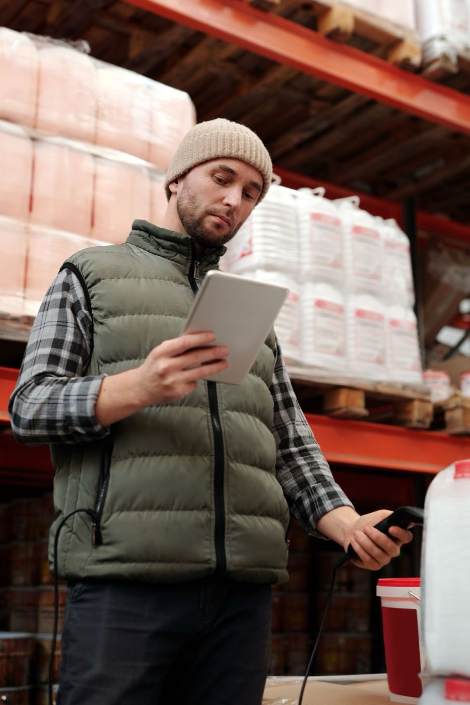 Warehouse management system at work — racked SKUs and a workstation inside a Lozy e-commerce warehouse in Delhi NCR
